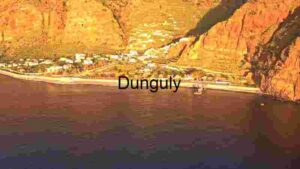 Golden Rocky Cliff near Blue Sea