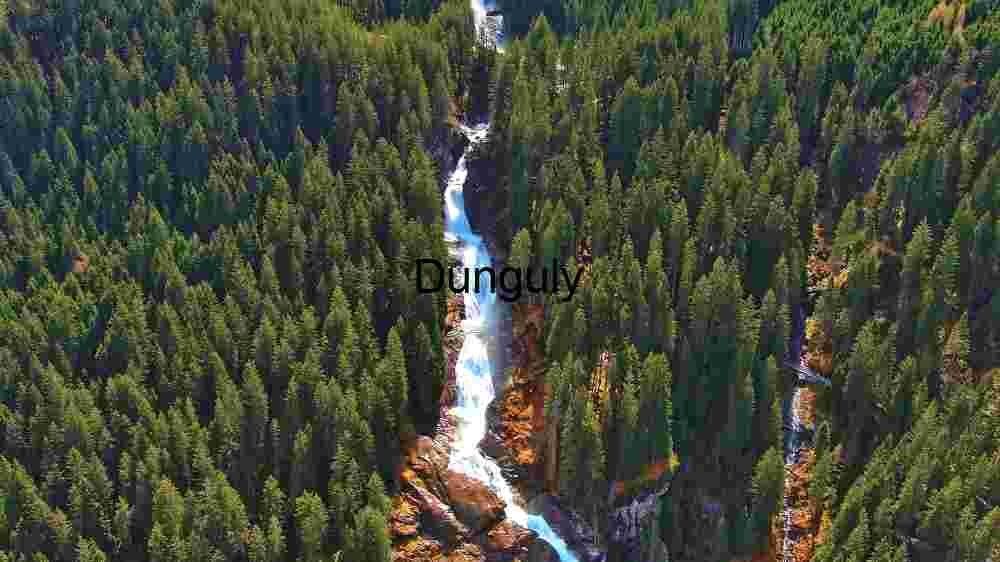 Reveal Earth's stunning terrain. Encounter breathtaking global vistas (19) Majestic Waterfall Amidst Lush Forest