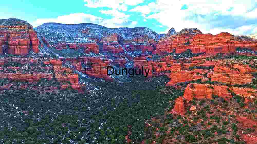 Reveal Earth's stunning terrain. Encounter breathtaking global vistas (26) Winter's Embrace: Red Rock Canyons Under a Snowy Blanket