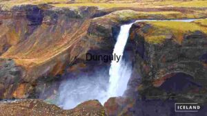 At Home Majestic Waterfall in Iceland's Rugged Terrain