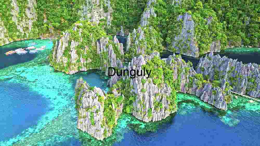Uncover Earth's stunning landscapes. Experience breathtaking worldwide views (30) Tropical Serenity: Limestone Cliffs Meet Crystal Waters