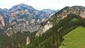 At Home Alpine Majesty: A Solitary Hut Amidst Lush Meadows and Rugged Mountains