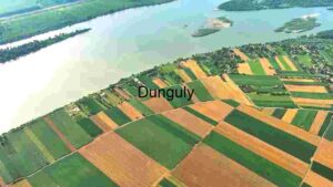 At Home Aerial View of Patchwork Farmland by the Lake