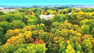 At Home Autumnal Aerial View of a Lush Forest with a Classical Building
