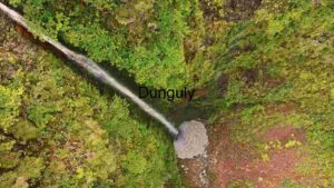 At Home Aerial View of a Secluded Waterfall in Lush Greenery