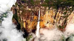 At Home Majestic Waterfall Amidst Cloud-Kissed Cliffs