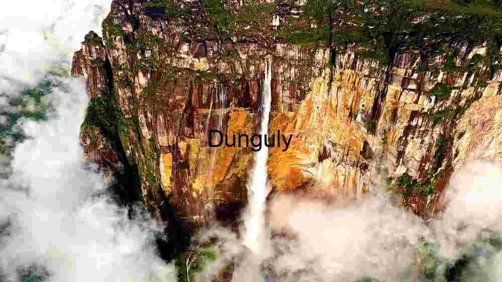 Incredible global spots nature wonders, cultural gems, and breathtaking vistas (79) Majestic Waterfall Amidst Cloud-Kissed Cliffs