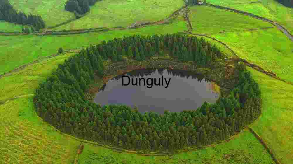 Revealing the Heavenly Textile Embracing Earth's Abundant Diversity Across Vast Landscapes (44) Verdant Oasis: The Aerial View of a Secluded Forest Lake