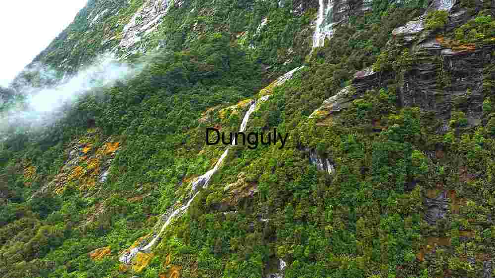 Witness Earth's innate splendor from above. Explore and professionally capture its natural beauty (46) Verdant Cliffs and Cascading Waterfalls