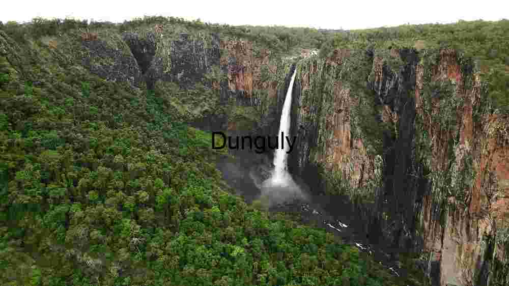 showcasing the Divine Weave Embracing Earth's Rich Diversity Across Expansive Landscapes (32) Majestic Waterfall in a Lush Canyon