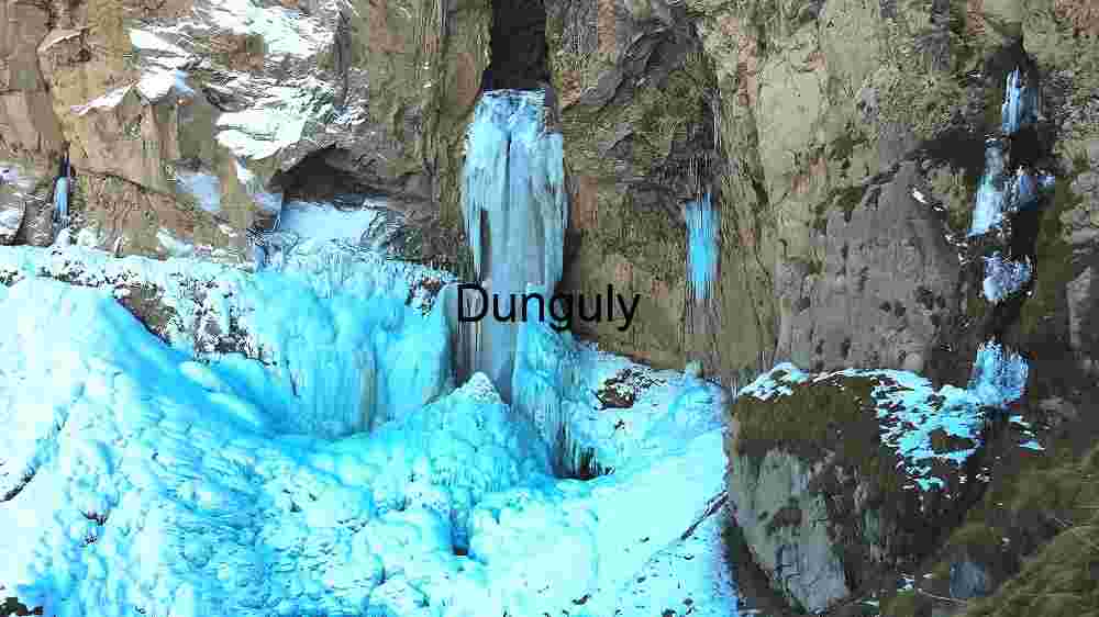 Capturing the Profound Diversity of Our Planet's Corners Cosmic Earthac (65) Frozen Waterfall in Rocky Terrain