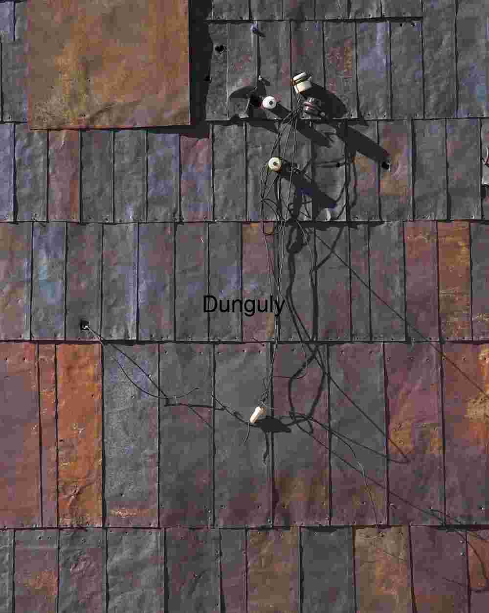 Telegraph_wires_and_metal_siding_Bodie_ghost_town Weathered Metal Wall with Electrical Components