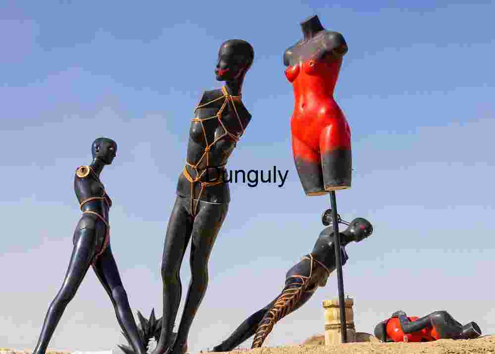 Impaled mannequins; Bombay Beach Tethered Forms Under Open Skies
