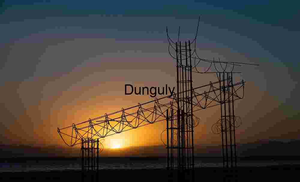 Sunsetover Salton Sea with rebar towers; Bombay Beach Sunset Silhouette: Abstract Structure Against Mountain Horizon