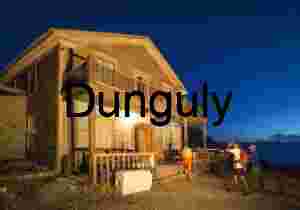 Rustic Lodge at Dusk with Hikers in Outdoor Gear
