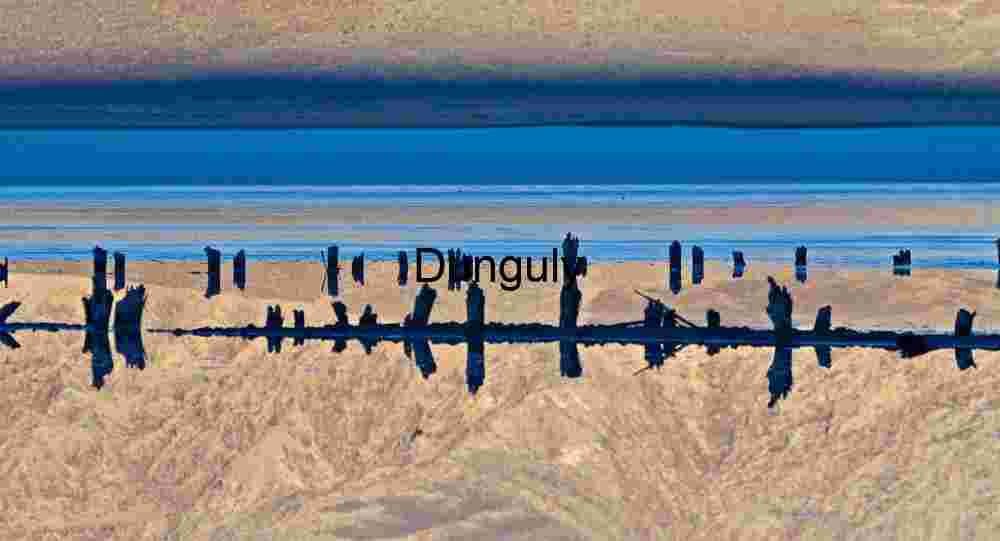 Blue bands, Saline Valley Wooden Posts Reflected in Desert Mirage with Mountain Backdrop