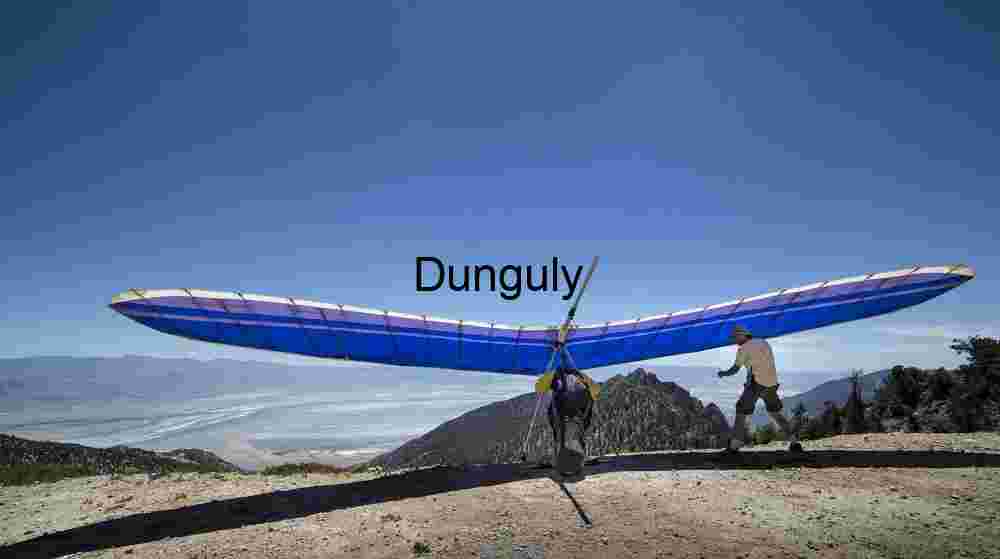 Blue glider readying for take-off, Walt's Point Adventure Sports in Mid‑Air — Hang Glider Silhouette Against Horizon