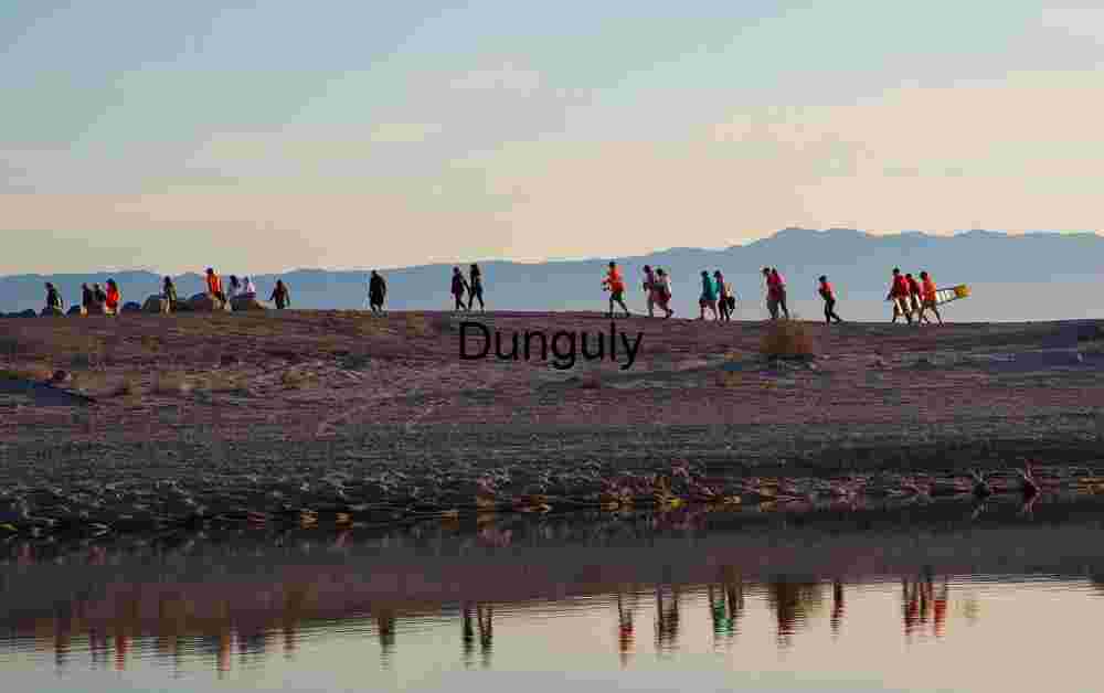 Crews walking back to their vehicles, Badwater Salton Sea Ultramarathon Desert Trekking Across Reflections