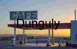 Sunset at Rural Gas Station and Café with Mountain Horizon
