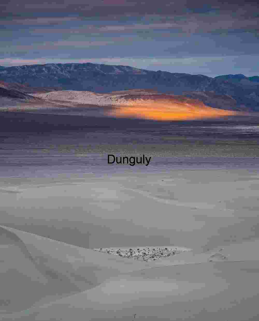 Morning spotlight on Eureka Valley #1 Illuminated Divide: Dunes, Shadows, and a Golden Ridge