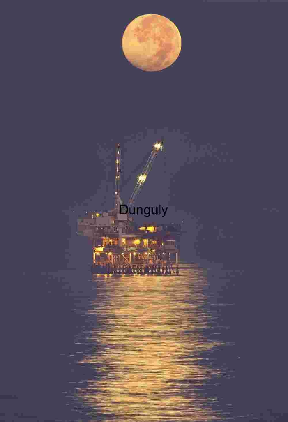 Oil rig moonset reflections, Huntington Beach, CA Offshore Oil Rig Under Crescent Moon