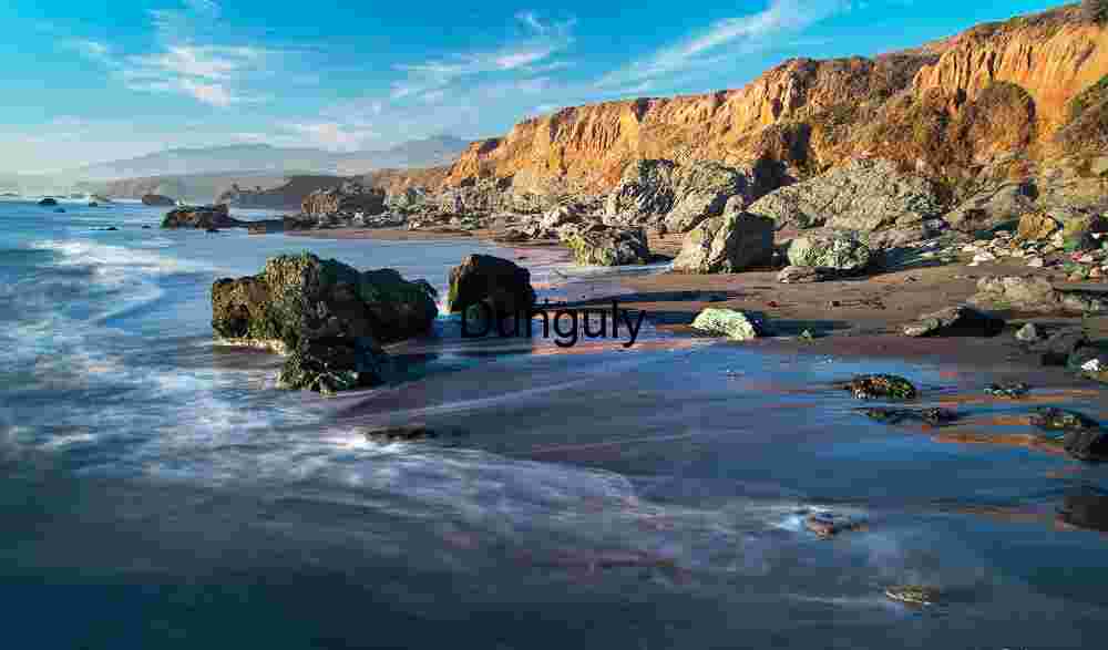 Piedras Blancas coastline- California Erosion & Elegance: Rocky Shoreline at Golden Hour