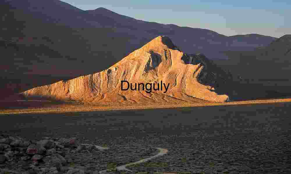 Striped Butte in the spotlight; Death Valley National Park Tilted Earth: Striated Peak Rising from the Desert Floor