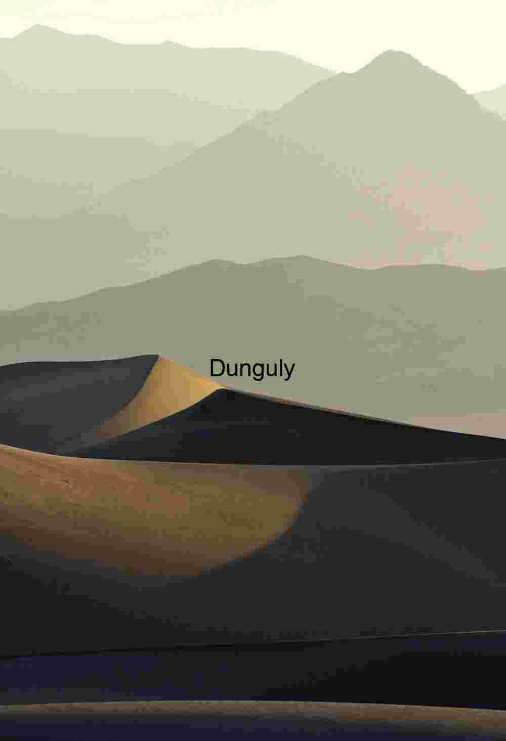 Sunrise - Stovepipe Wells Dunes Contours of Silence: Sunlit Dunes Beneath Hazy Peaks