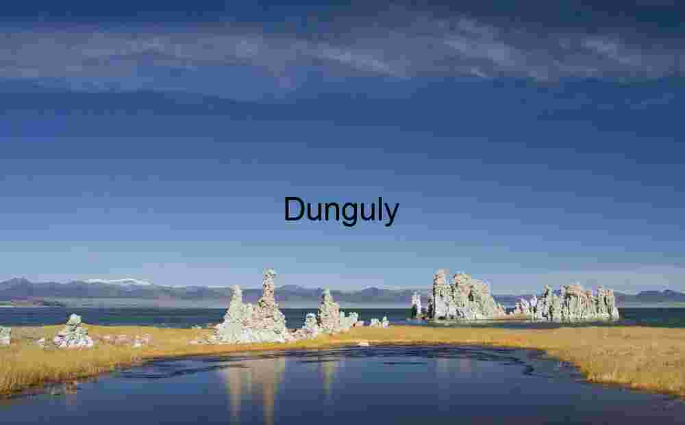 Tufa reflections in lagoon, beyond Navy Beach, Monoo Lake Tufa Towers, Golden Grasses, and Snow‑Capped Peaks at Mono Lake
