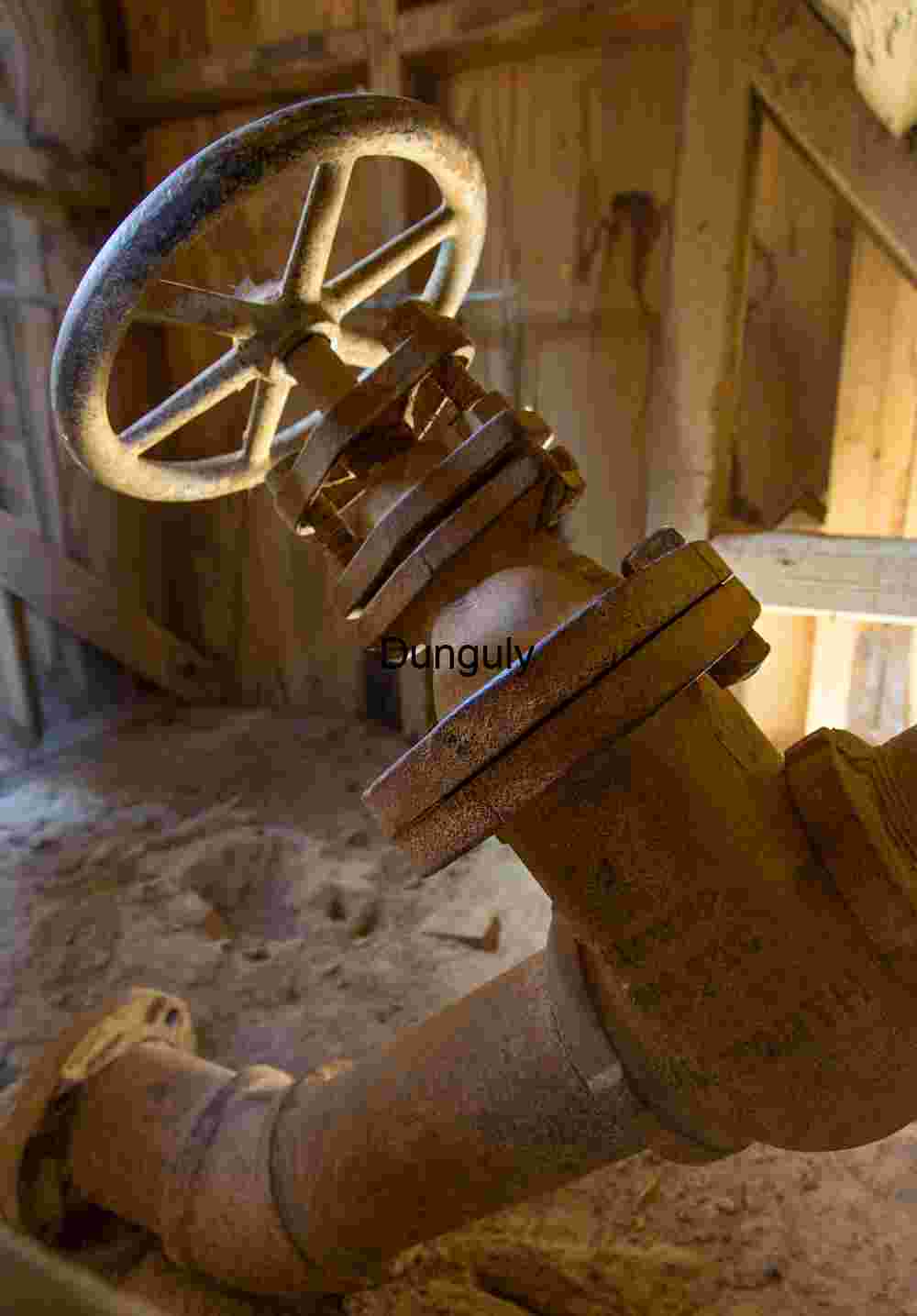 Water valve- Log cabin mine, Lee Vining Rusted Industrial Valve in Weathered Utility Shed