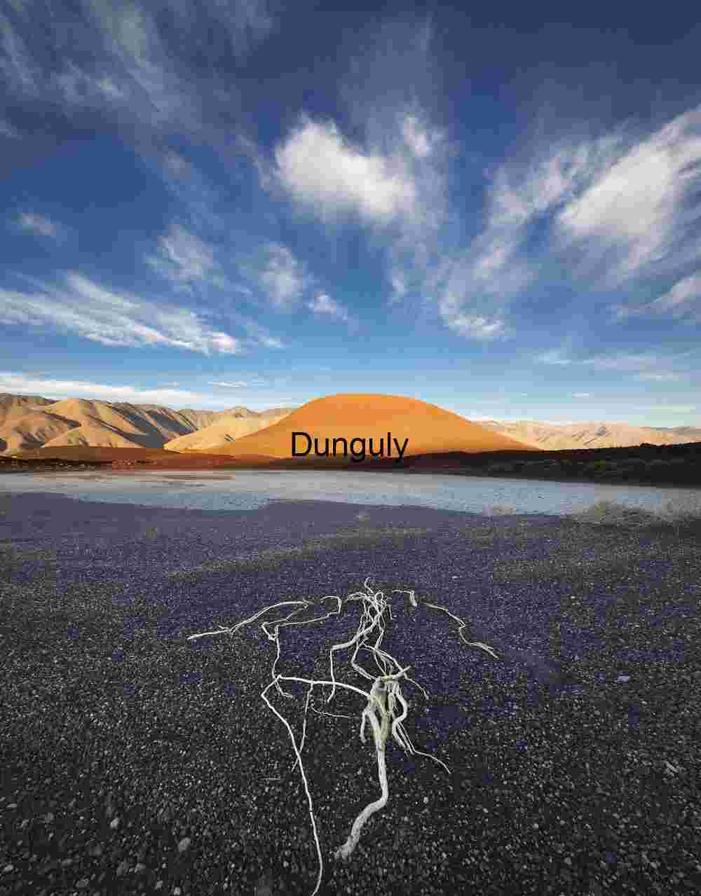 Cinder cone with black ash foreground Volcanic Cinder Cone Sunset - Barren Desert Landscape