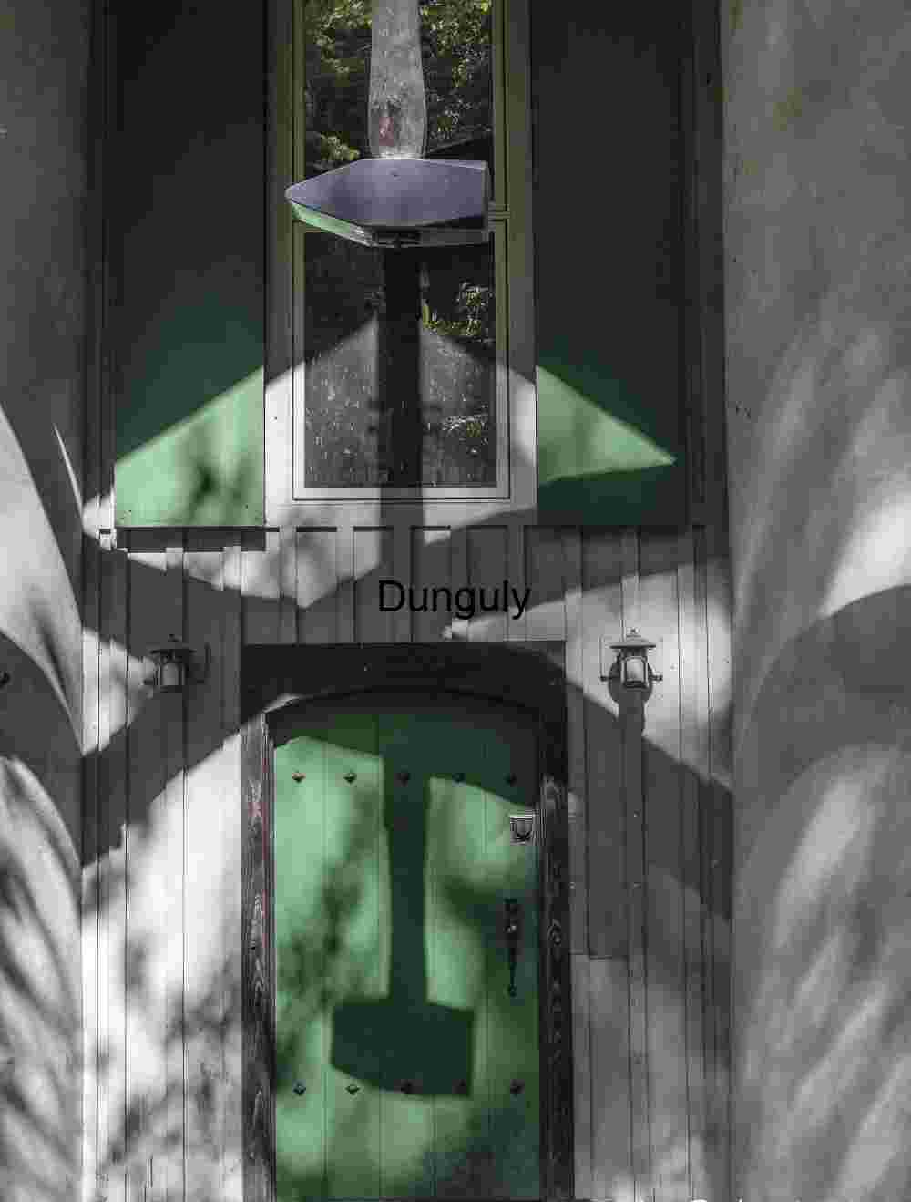 Hammer and shadow; Dramatic Hammer Shadow on Green Door: Light & Architecture
