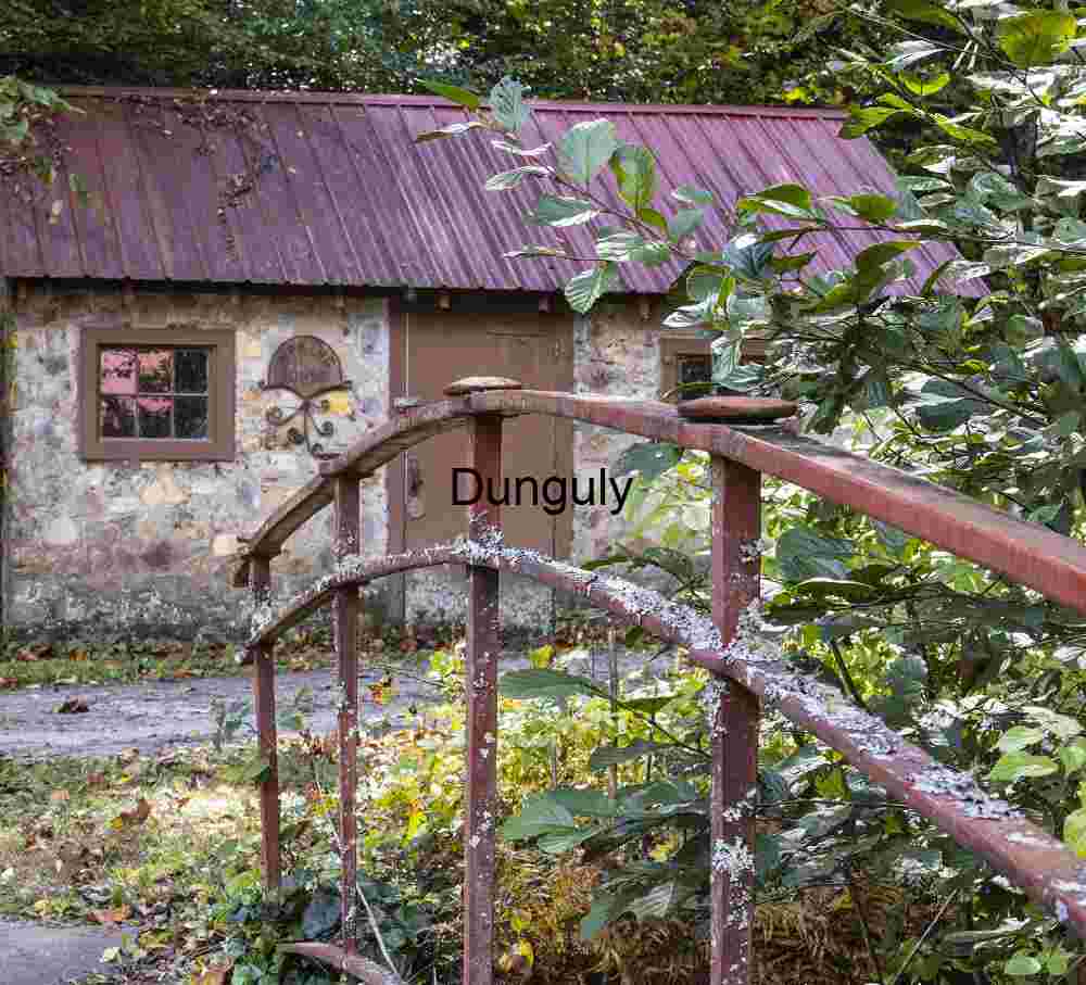 Shed and footbridge by Mill House; John C. Campbell Folk School Rustic Stone Shed & Red Footbridge: Folk School Charm