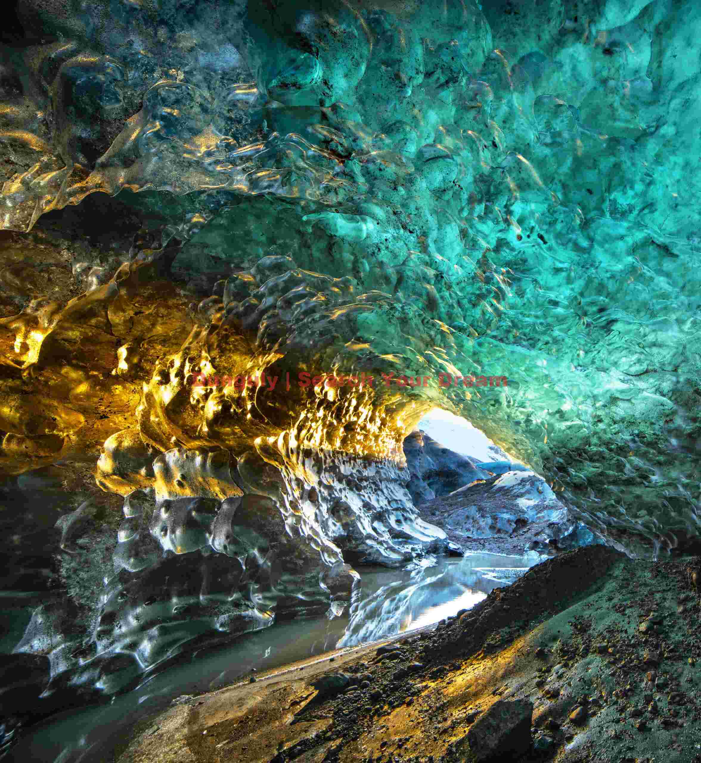 Icelandic TV presenter in the Golden ice cave, Vatnajokull, Iceland Glacial Ice Formation at Icelandic TV presenter in the Golden ice cave, Vatnajokull, Iceland