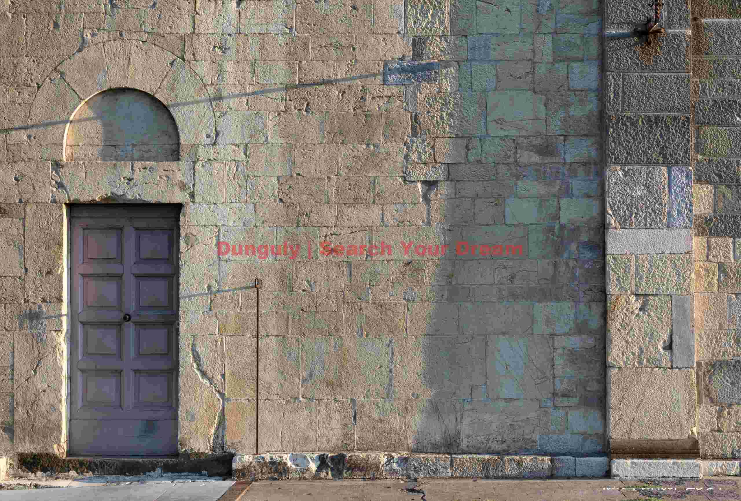 Duomo doorway illuminated by slanting sunrays; Barga, Tuscany Duomo doorway illuminated by slanting sunrays