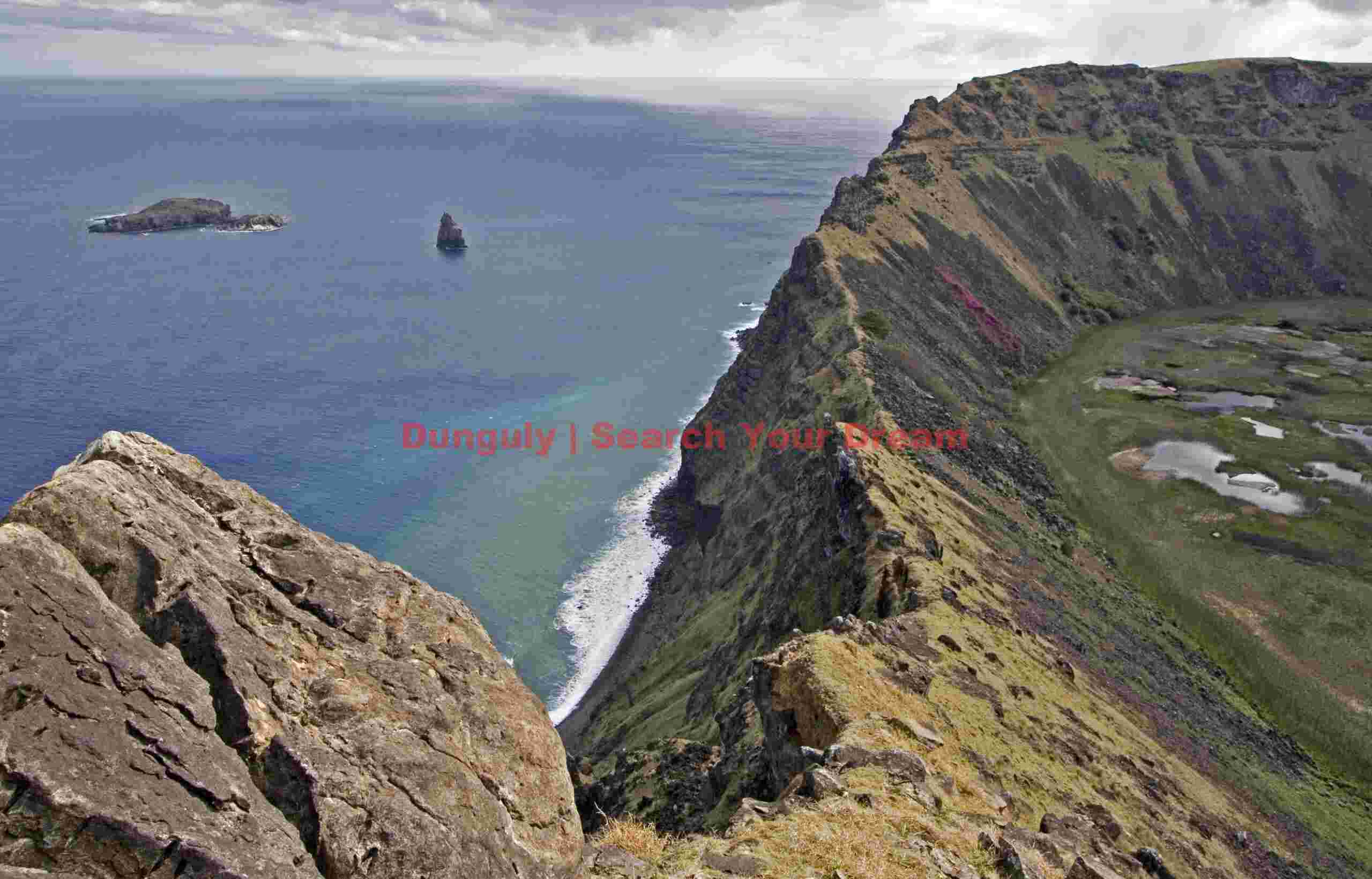 Easter Island - Rano Kao - Moto Nui (the Birdman island) through breach in crater wall Easter Island - Rano Kao - Moto Nui (the Birdman Island) Through Breach in Crater Wall
