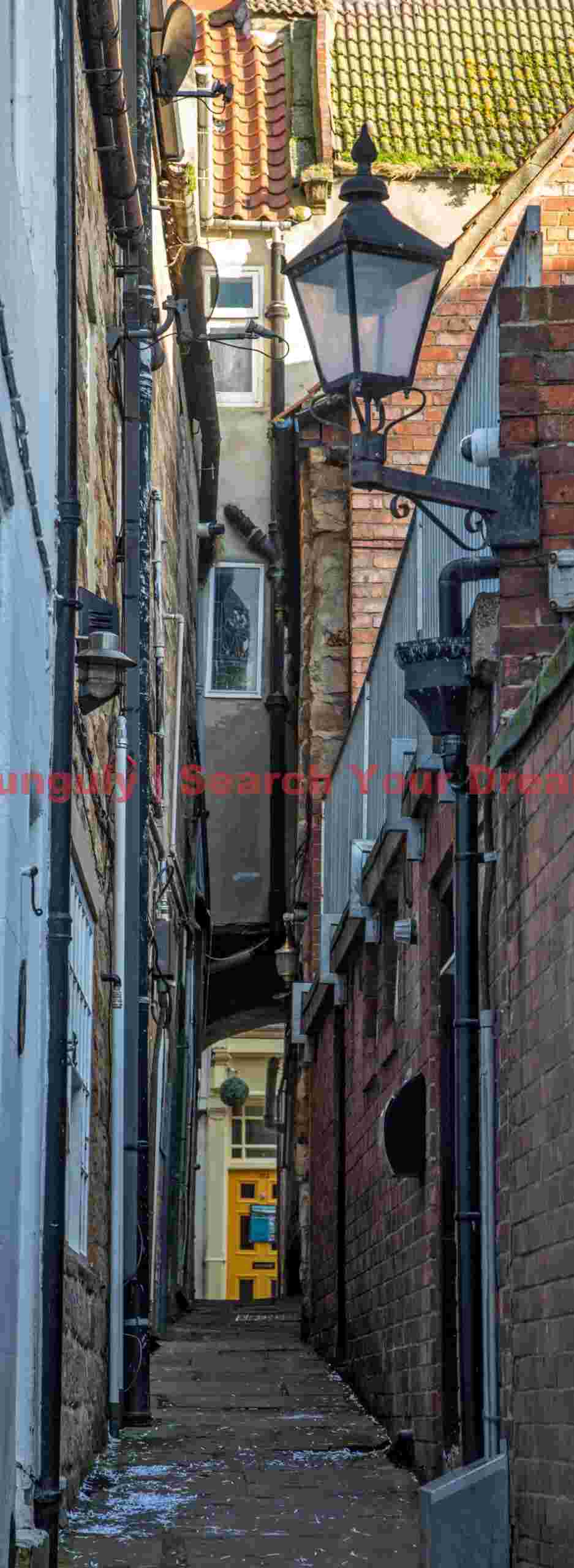 Street lamp in narrow alley; Whitby, Yorkshire Street lamp in narrow alley