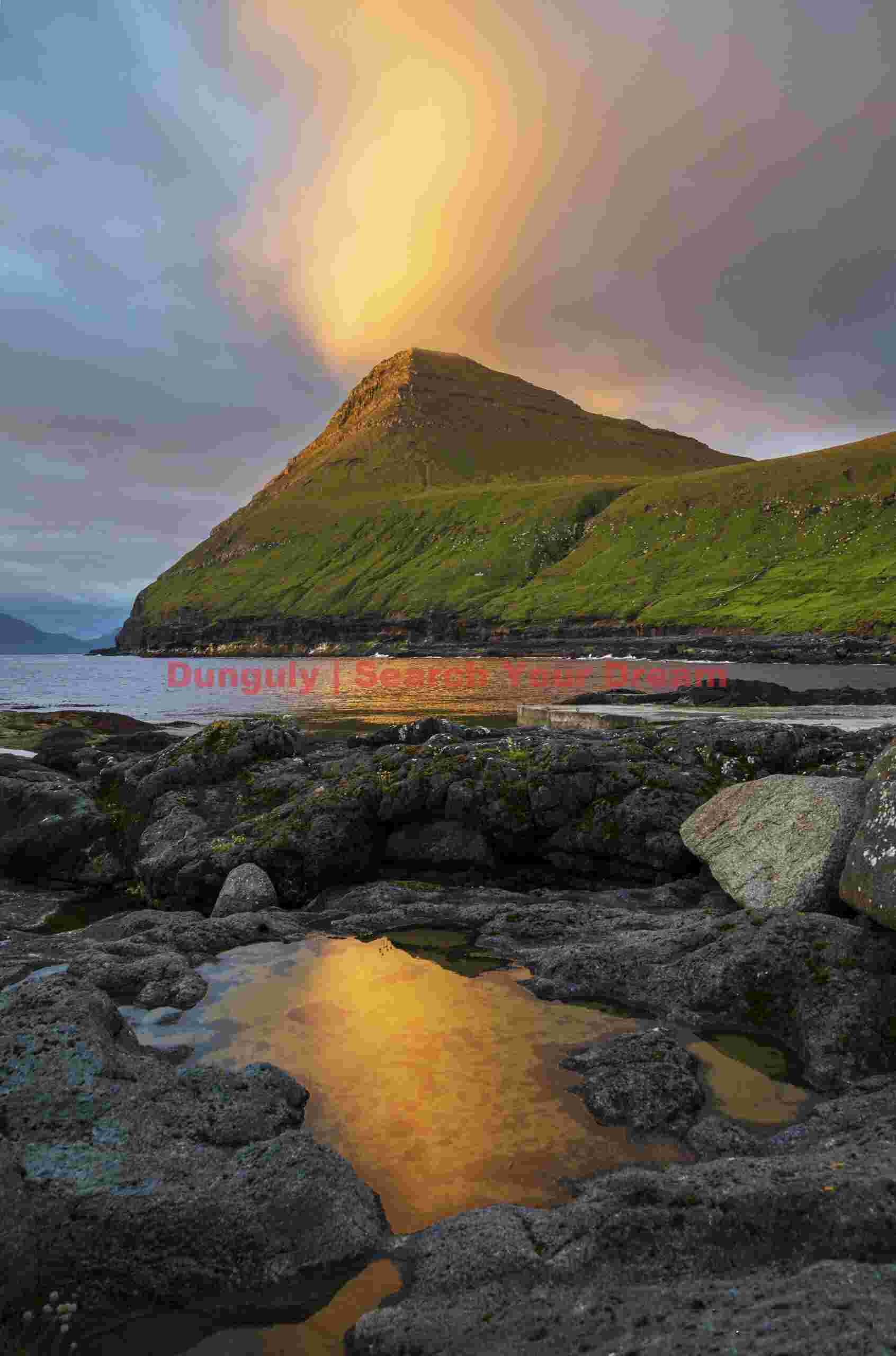 Sunrise cloud reflected in tidepool; Gjógv, Faroe Islands Sunrise cloud reflected in tidepool