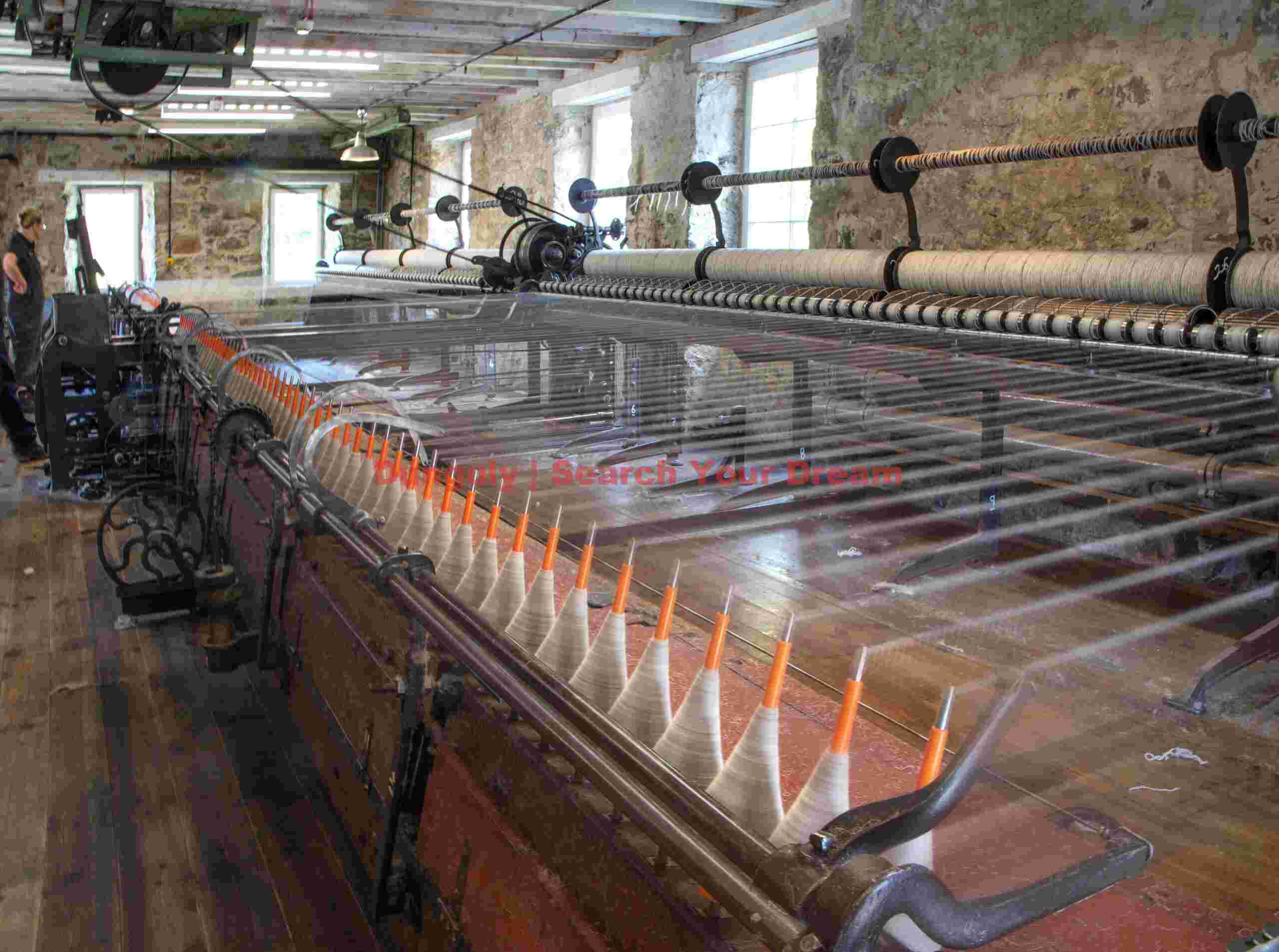 Wool spinning machine in action; Knockando Wool Mill Wool spinning machine in action