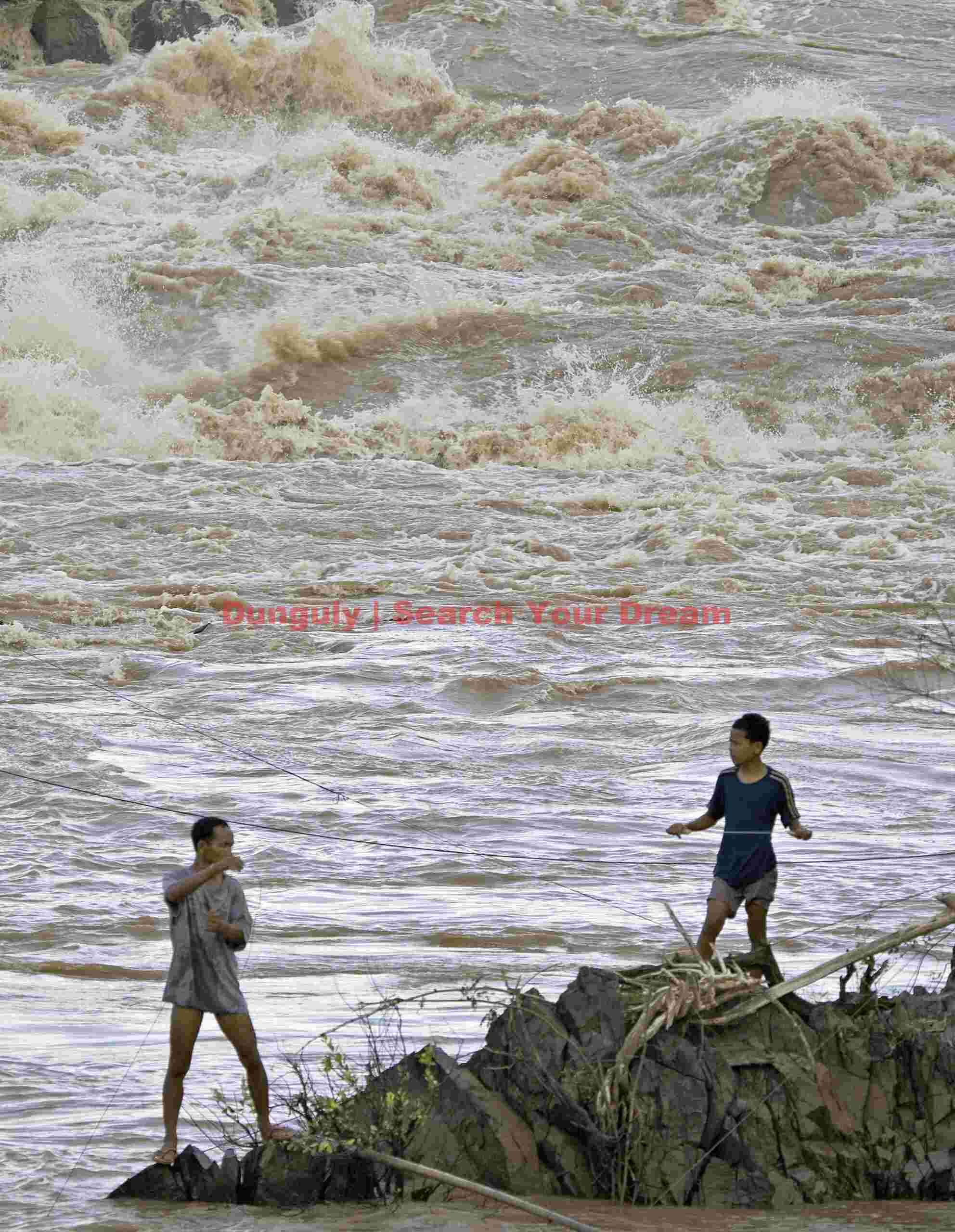 Arranging fishing lines; Liphi Rapids, Phapheng Falls, Mekong River, Laos Arranging fishing lines