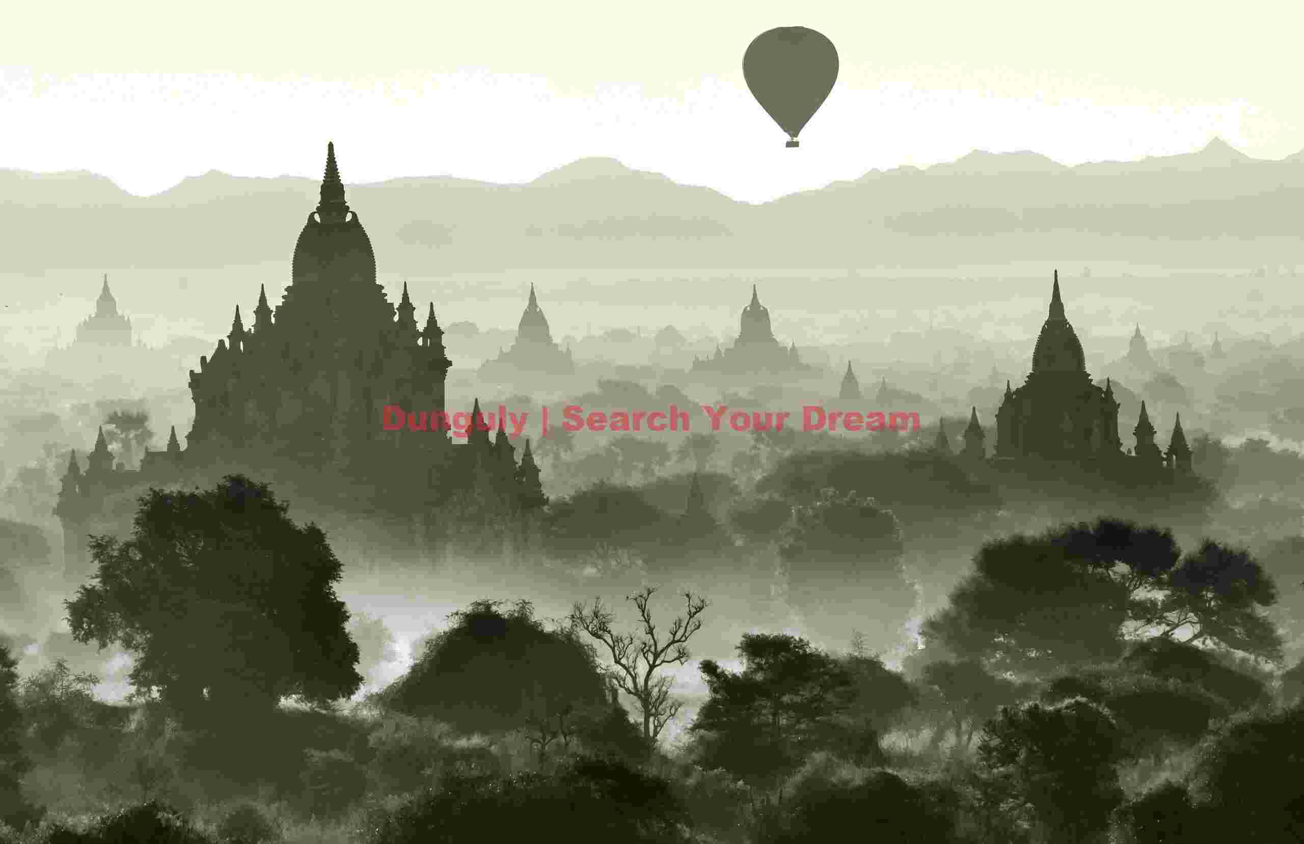 Balloon and tree sillhouetted by mist before the temples; Bagan, Burma Balloon and tree sillhouetted by mist before the temples