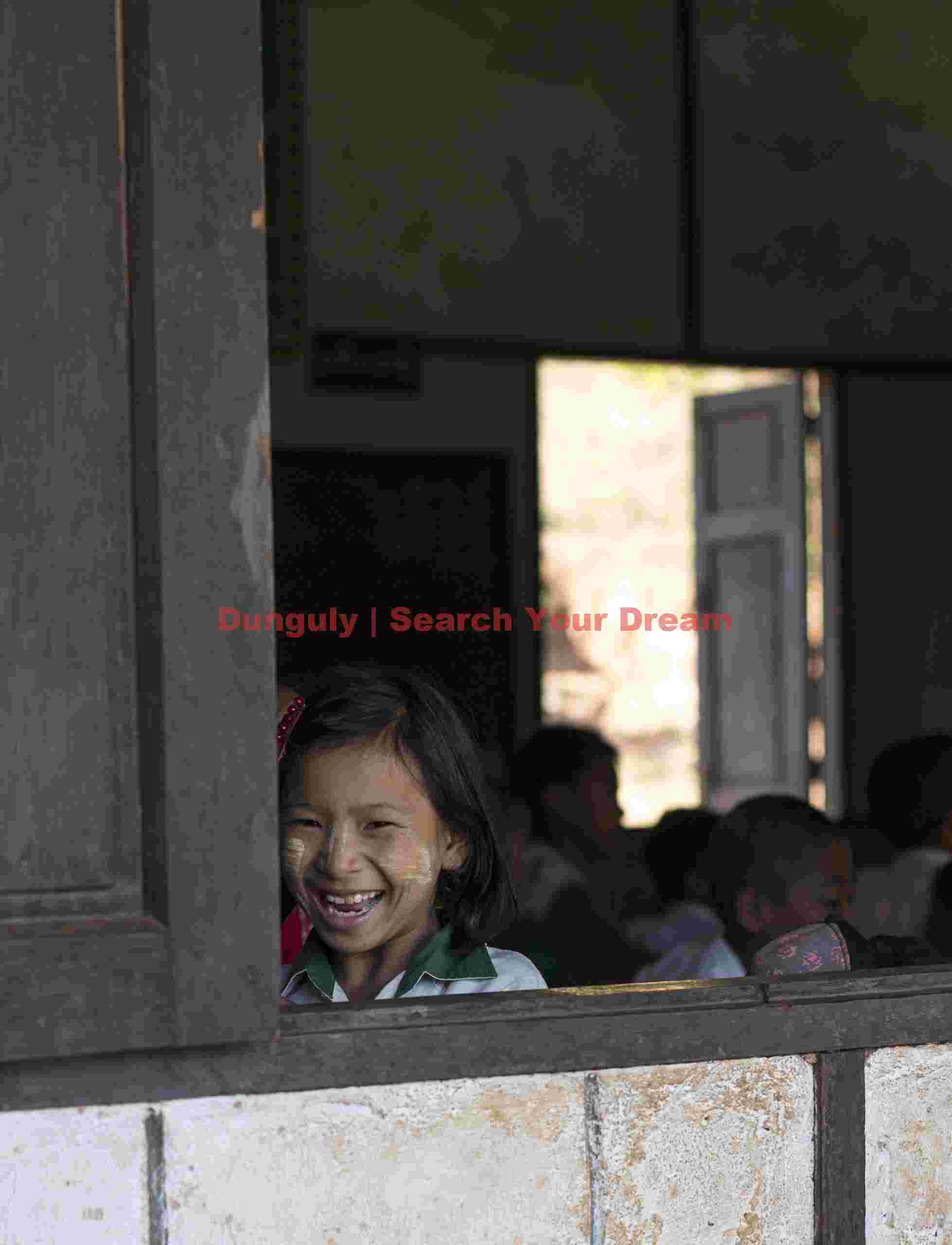 Burmese schoolgirl at window corner Burmese schoolgirl at window corner