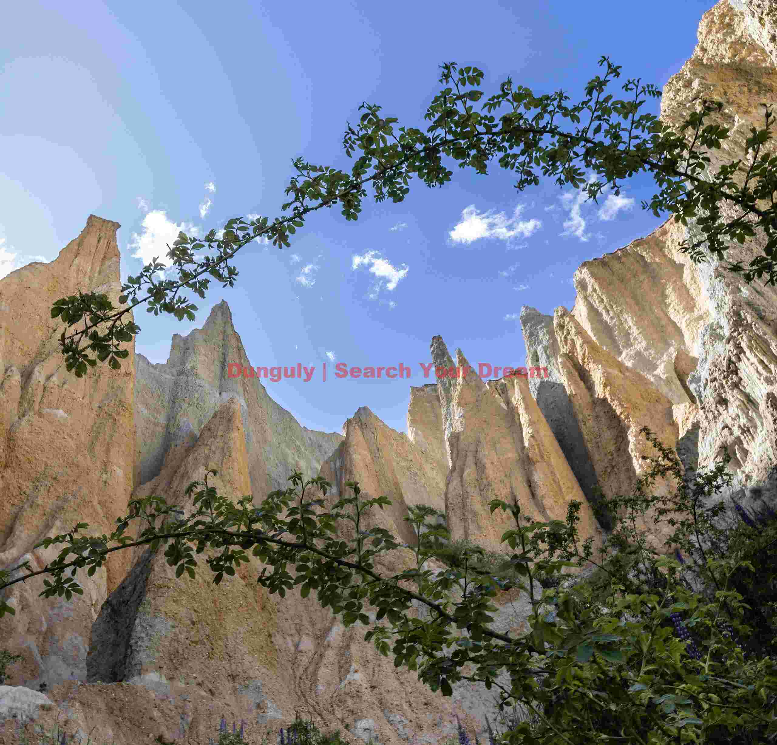 Clay cliffs of Omarama framed in double arch; South Island, New Zealand - Copy Clay cliffs of Omarama framed in double arch