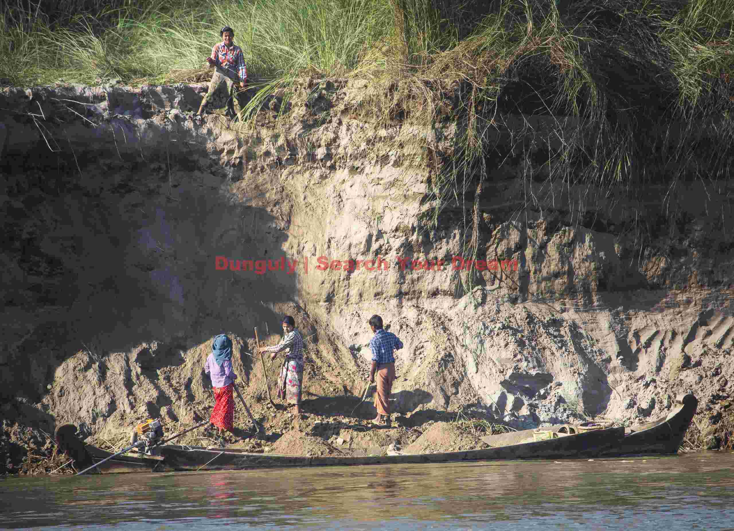 Digging sand on island in the Ayerwaddy river; Mandalay, Burma Digging sand on island in the Ayerwaddy river