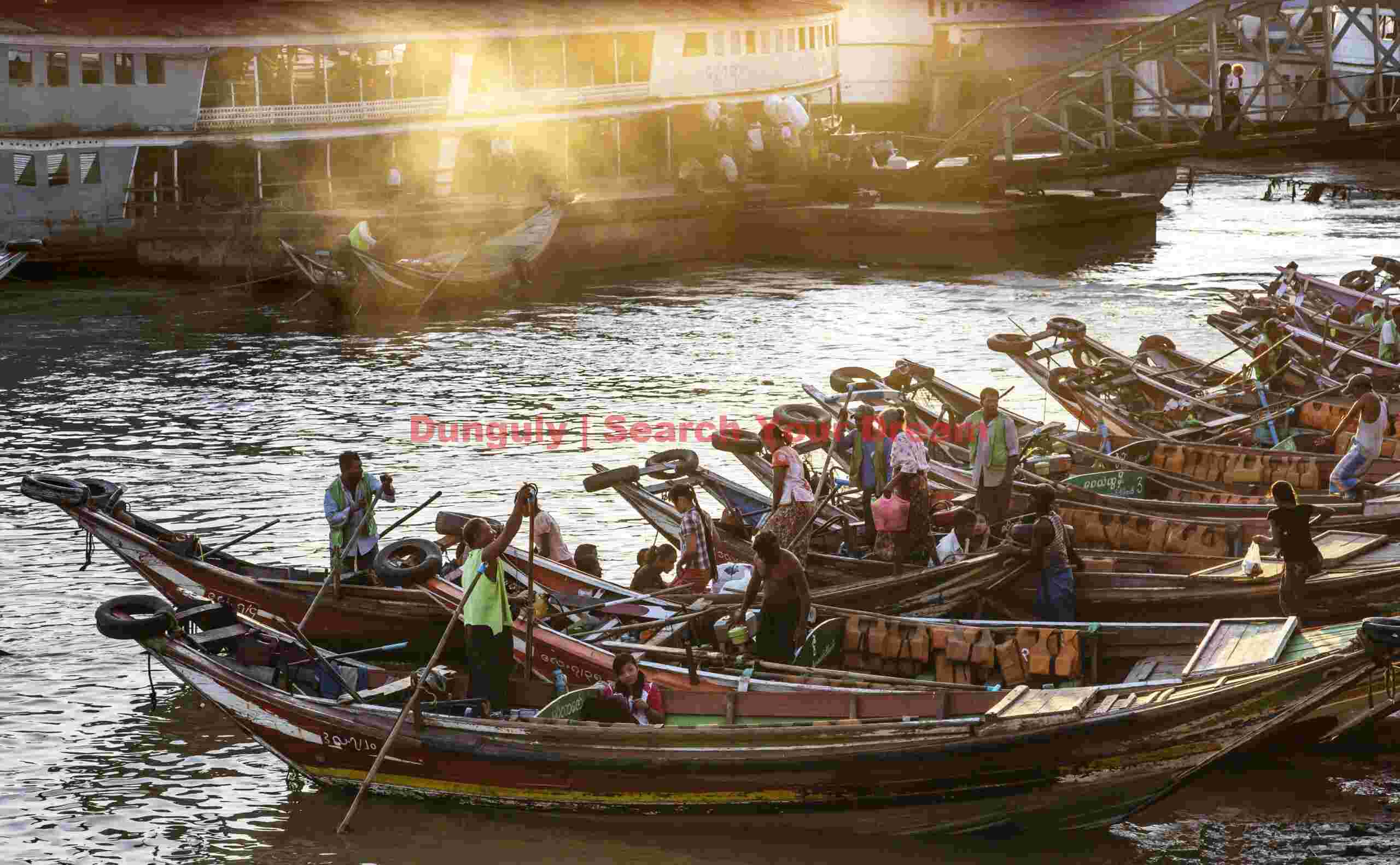 Ferry boats lined up at sunset; Yangon, Burma Ferry boats lined up at sunset