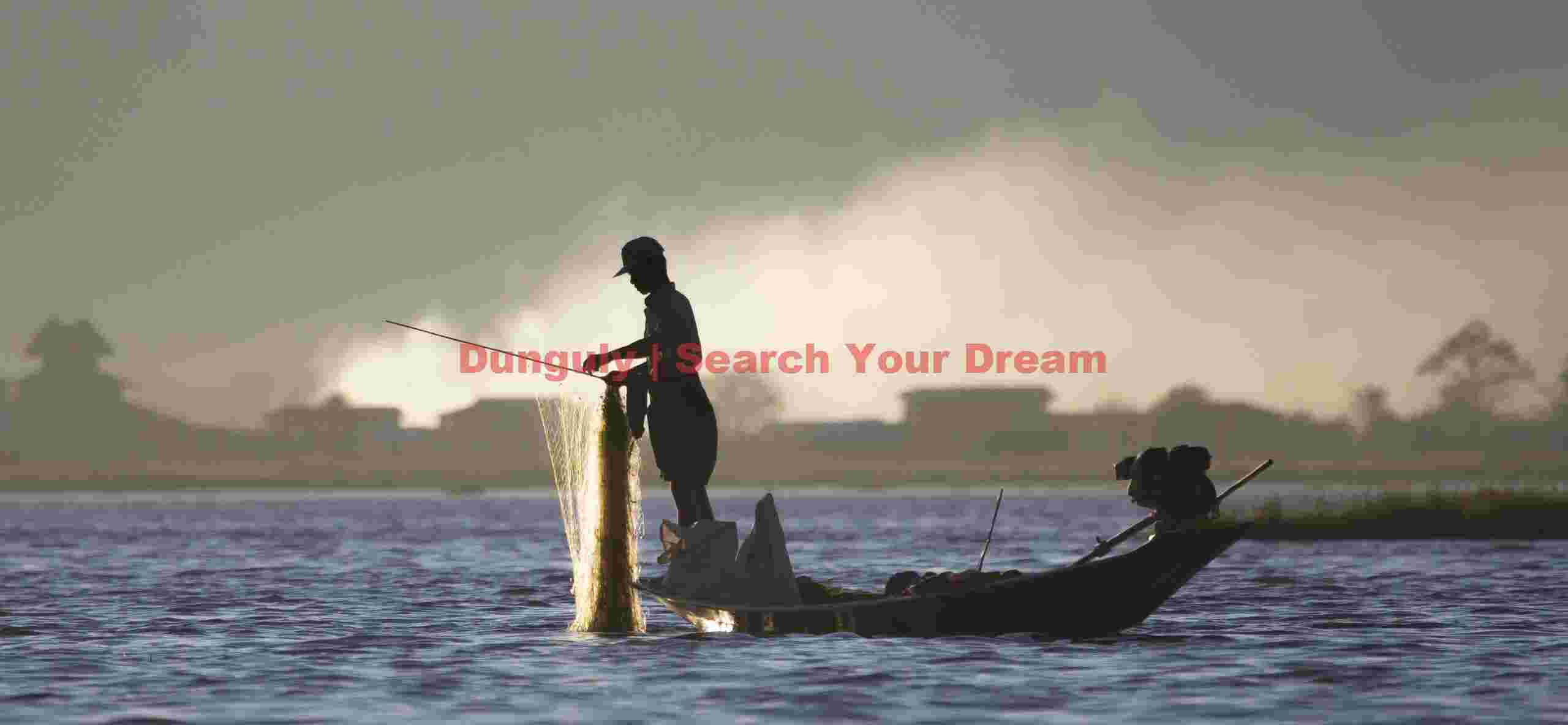 Fisherman backlit against smoke; Inle Lake, Burma Fisherman backlit against smoke