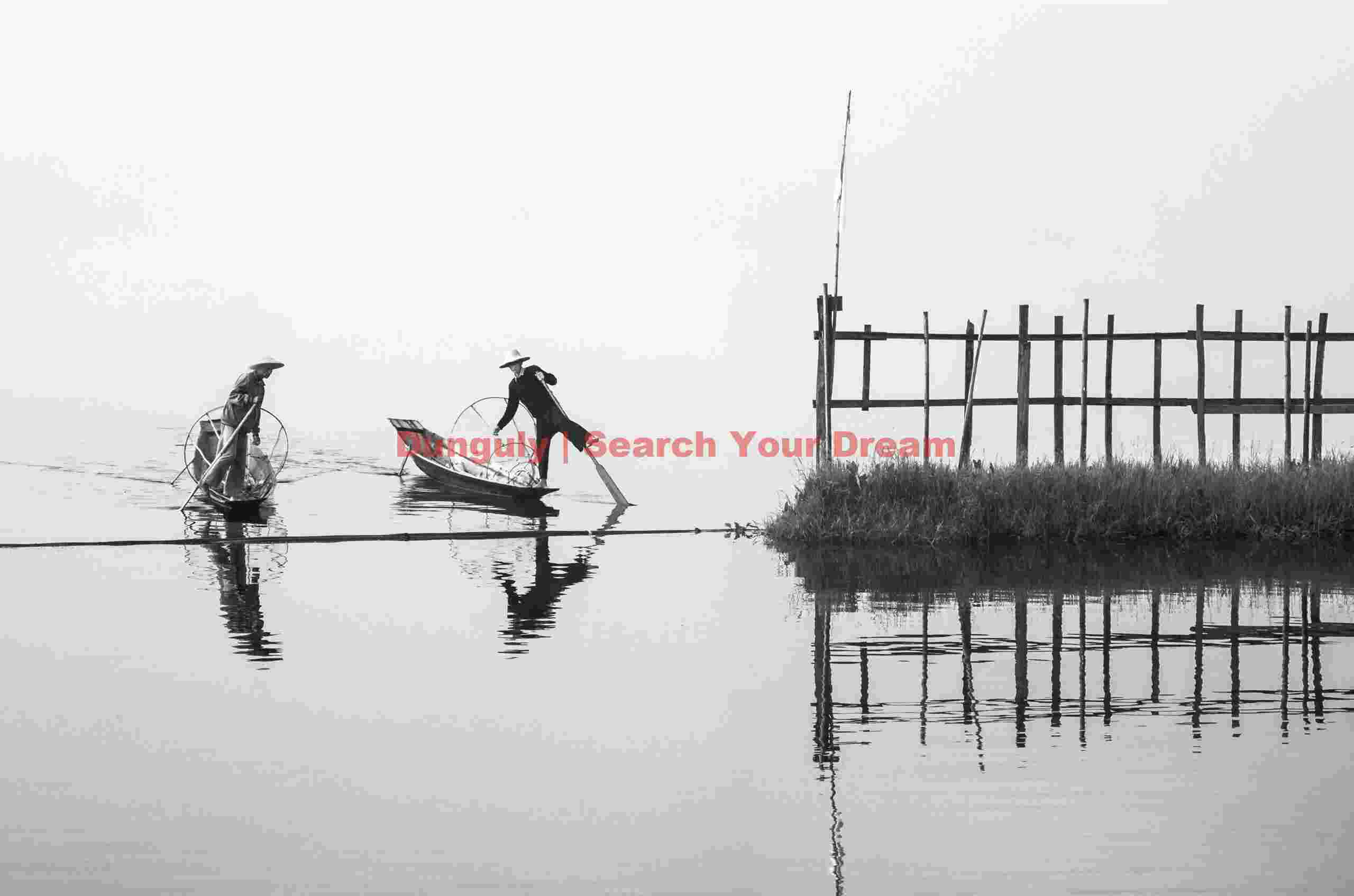 Fishermen crossing the gate into Golden Island Cottages; Inle Lake, Burma Fishermen crossing the gate into Golden Island Cottages