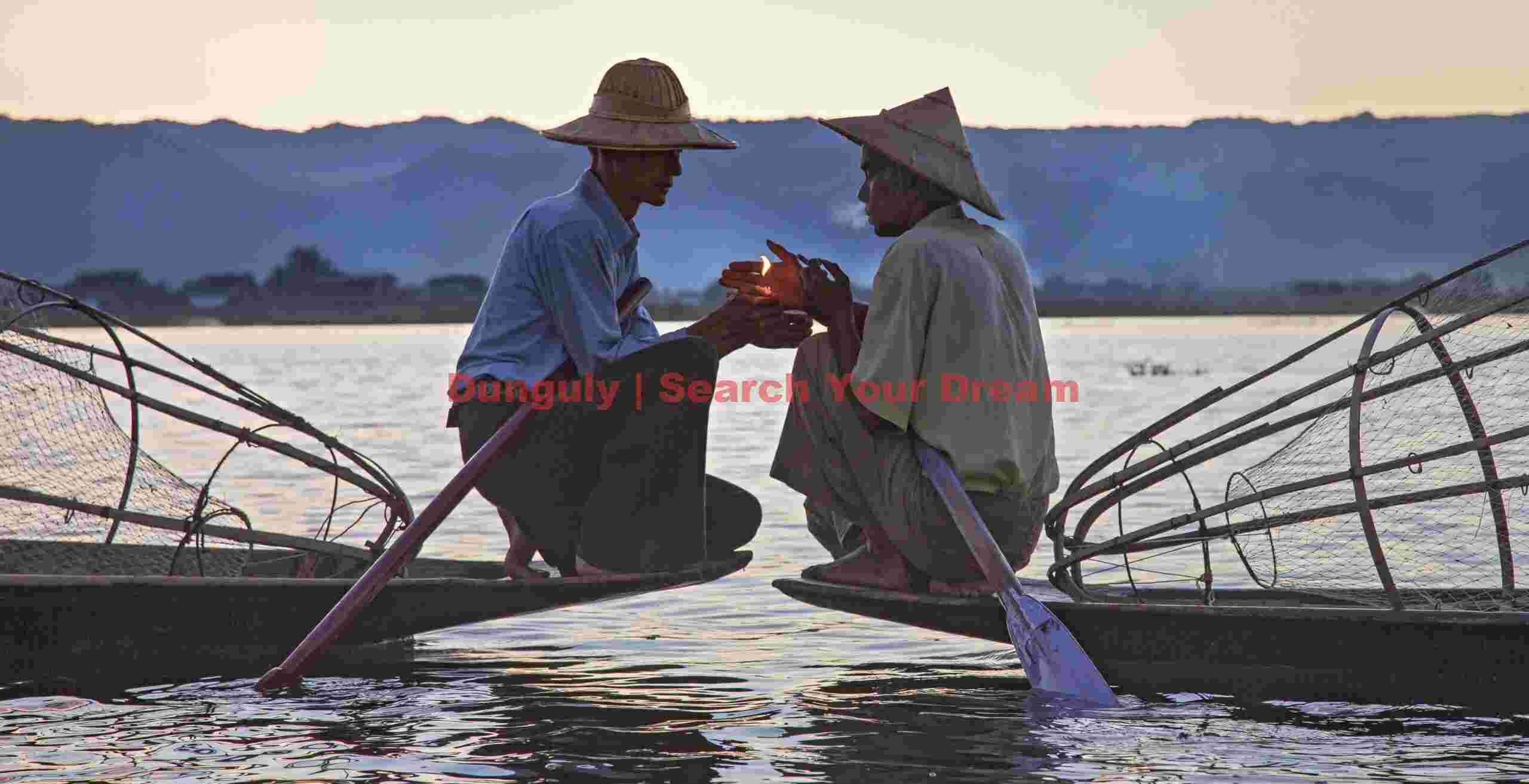 Fishermen sharing a light; Inle Lake, Burma Fishermen sharing a light