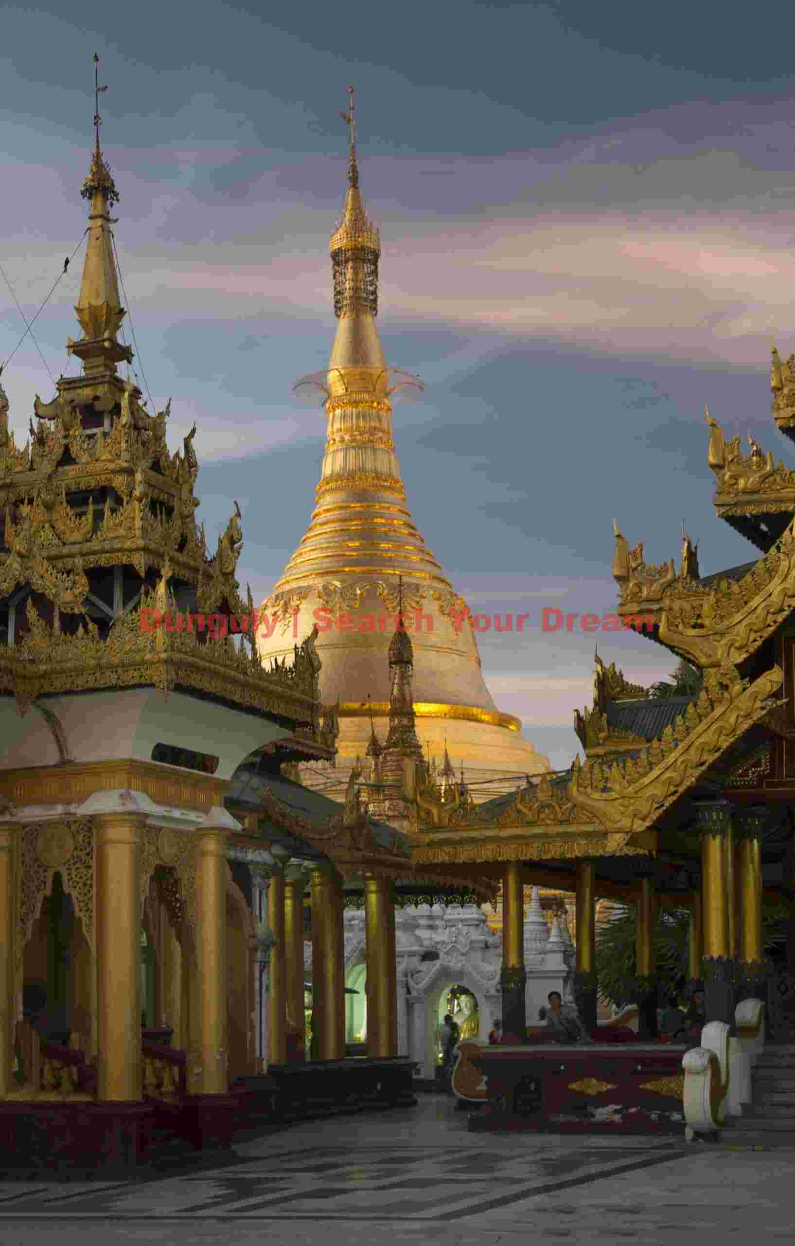 Golden spires at sunset; Shwedagon Pagoda, Yangon, Burma Golden spires at sunset
