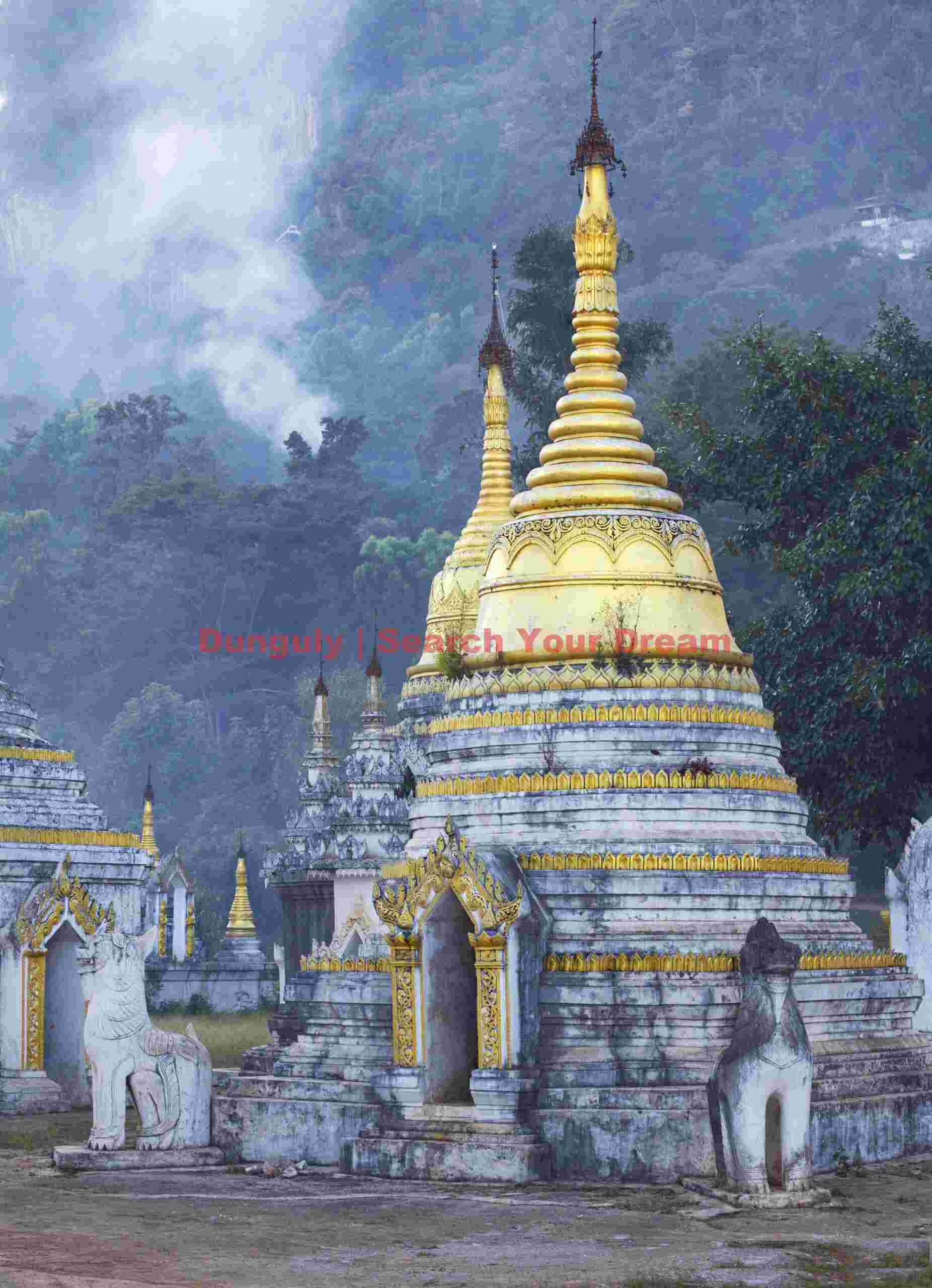 Golden stupa against smoke from hill fires; Pindaya, Burma Golden stupa against smoke from hill fires